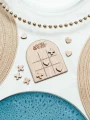 wooden wedding table game in use by guests at a reception