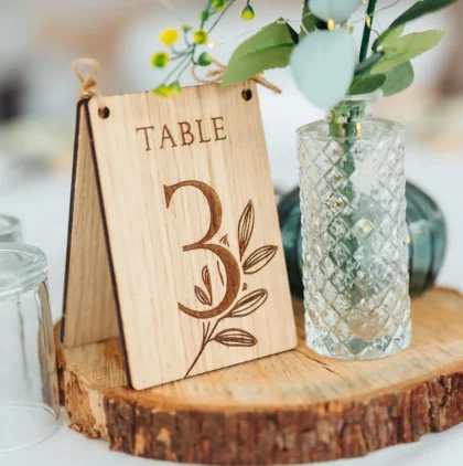 personalised wooden CluckingBelle Designs product — wildflower engraved oak place numbers