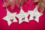 close-up of pet memorial engraved wooden Christmas bauble showing personalised detail