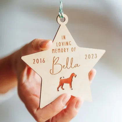 pet memorial personalised Christmas bauble hanging on a Christmas tree