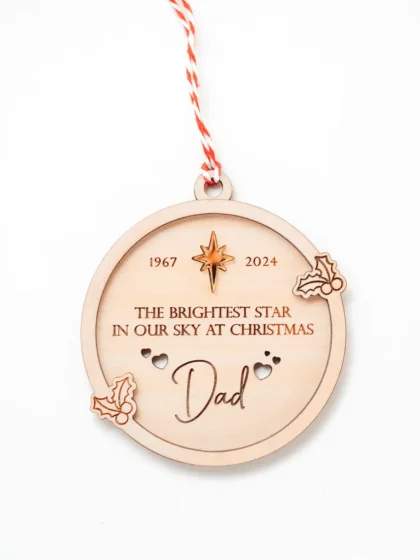 close-up of pet memorial engraved wooden Christmas bauble showing personalised detail