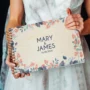 personalised wooden wedding guest book lying flat showing landscape format and copper spiral wire binding