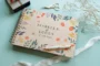Bold botanical wedding guest book showing A4 and A5 size options side by side with spiral wire binding