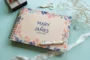 personalised floral engraved wedding guest book cover detail with laser-engraved floral design