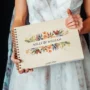 personalised floral engraved wedding guest book cover detail with laser-engraved floral design
