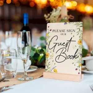 personalised wooden wedding guest book showing interior pages with lines for guest signatures and messages