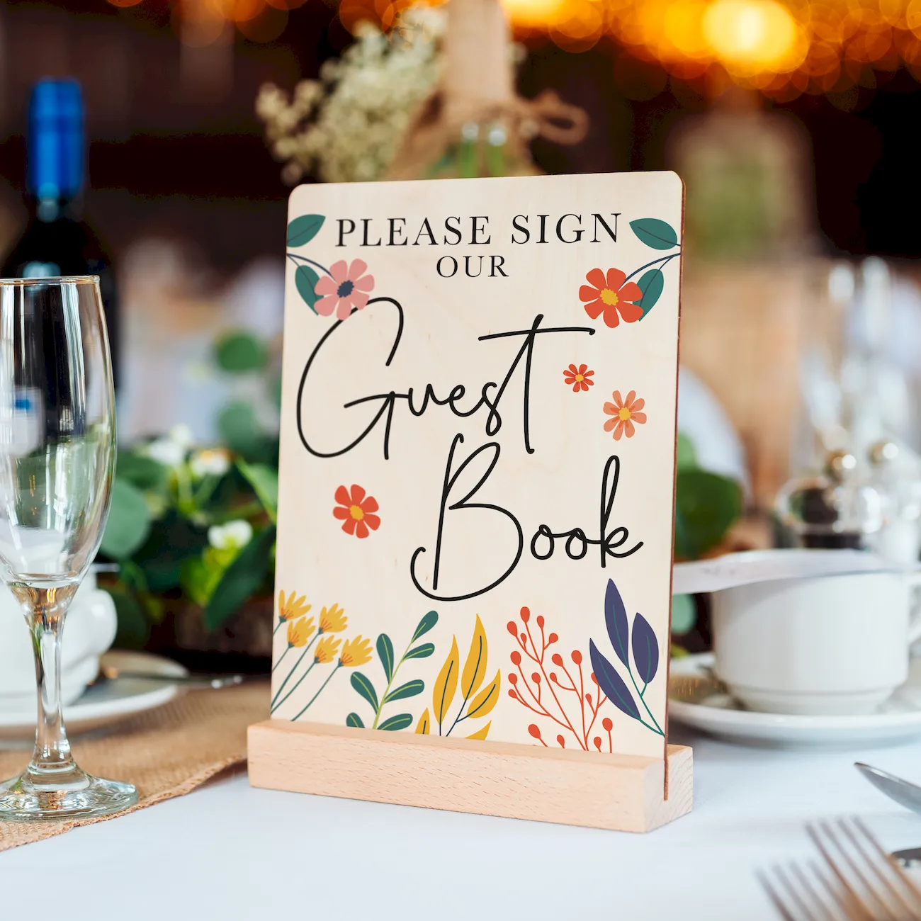 a bright colourful floral wedding sign