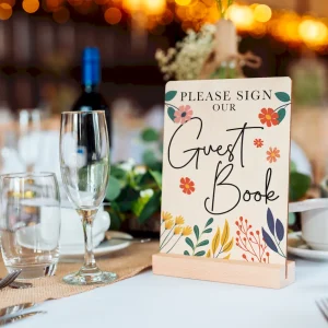wildflower engraved wooden guest book cover with natural wood grain visible through engraving
