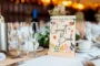 wildflower engraved wooden guest book cover with natural wood grain visible through engraving