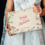 open personalised wooden wedding guest book with handwritten guest messages on white pages