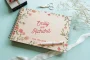 personalised floral engraved wedding guest book cover detail with laser-engraved floral design