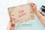 floral engraved personalised wooden wedding guest book with spiral wire binding and personalised wooden cover