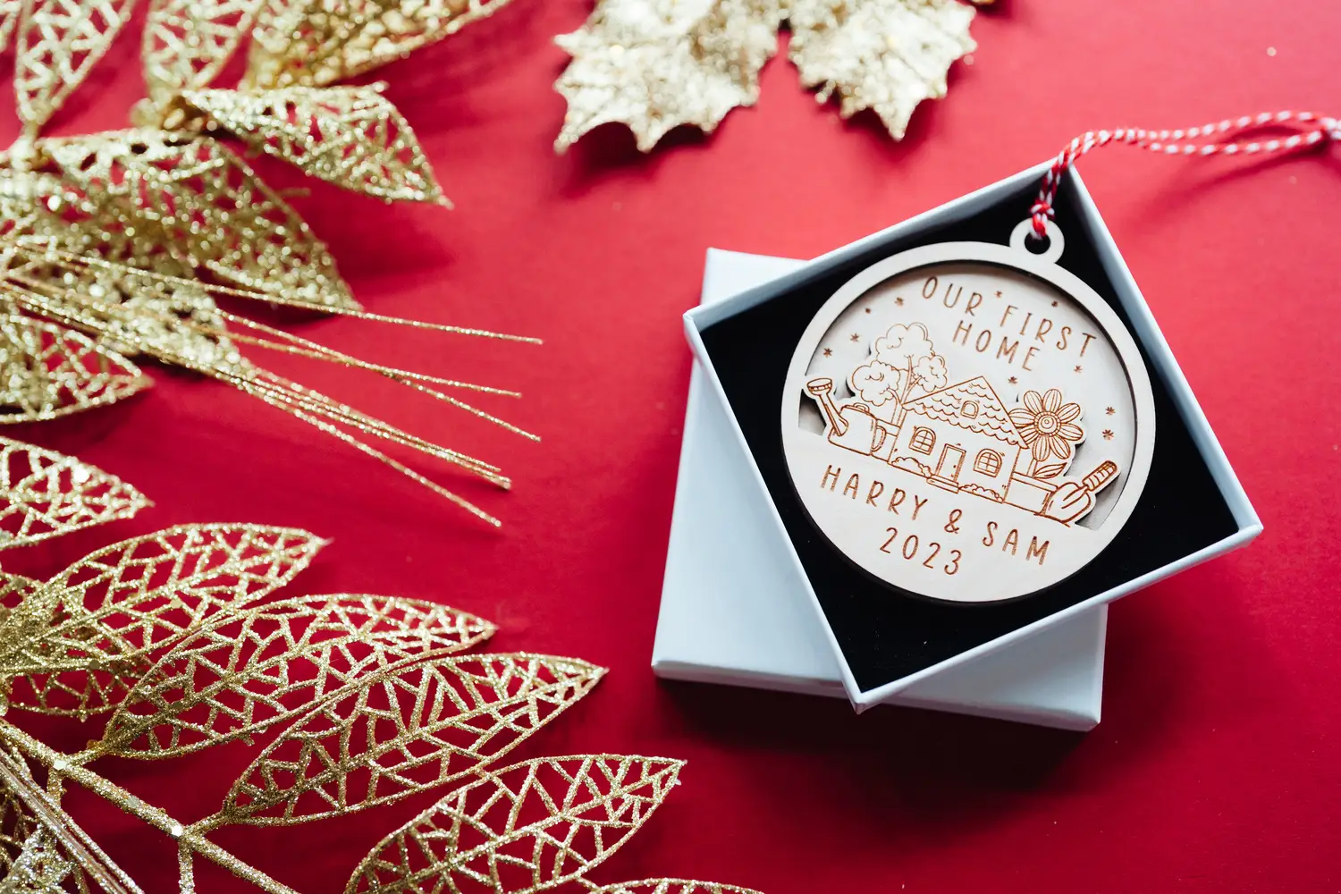 04-11-2023-17-08-50.webp Close-up of the our first home christmas bauble engraved detail
