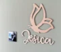 Butterfly kids room sign displayed on a shelf