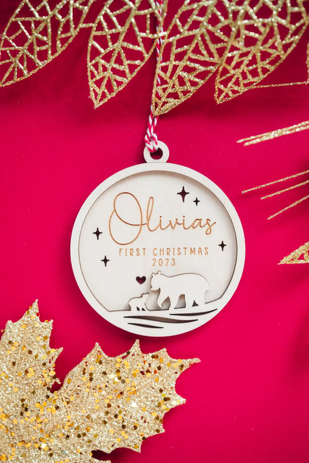 Laser-engraved wooden mama bear first christmas bauble with ribbon