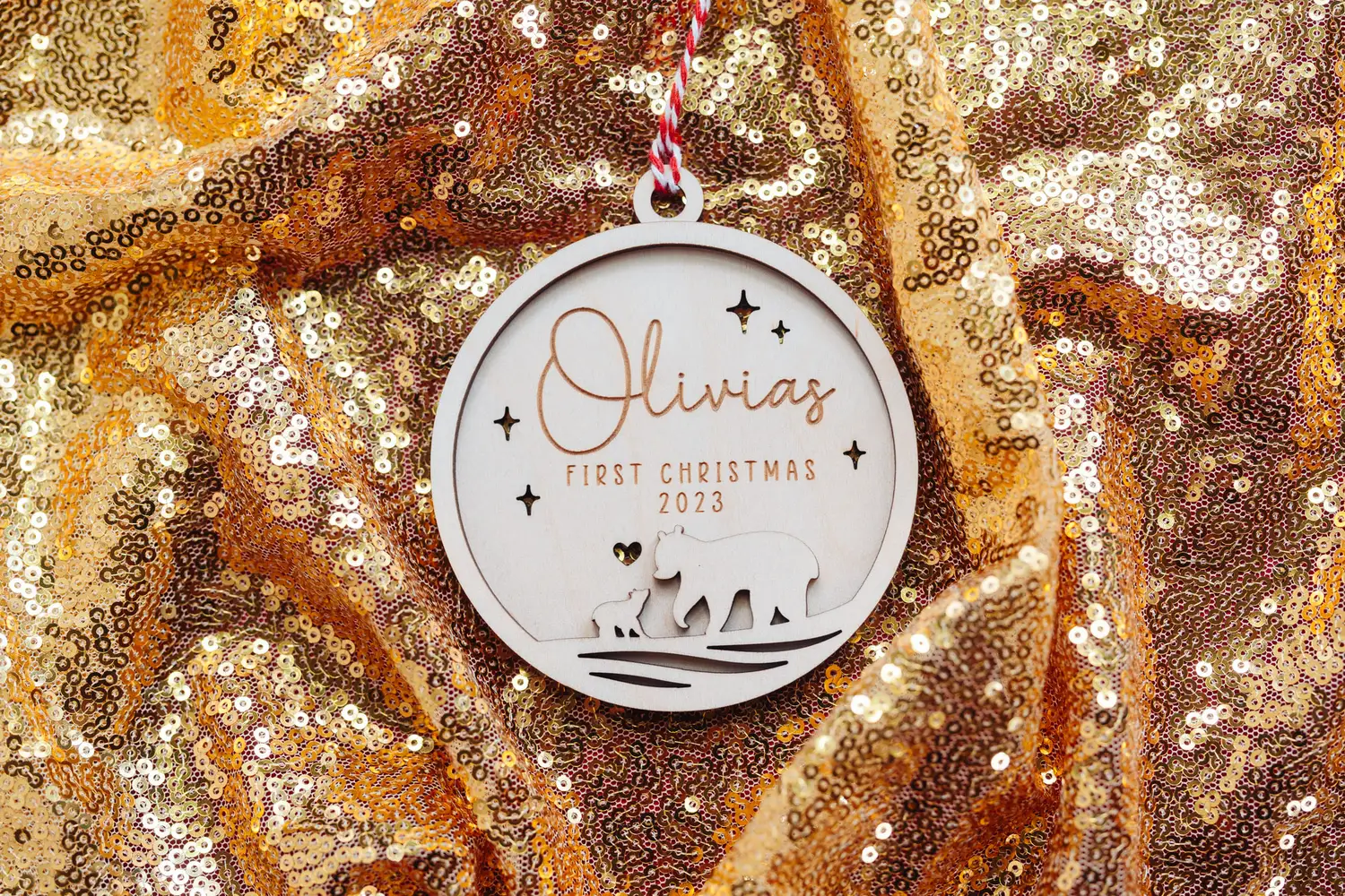 Mama Bear First Christmas Bauble hanging on a Christmas tree