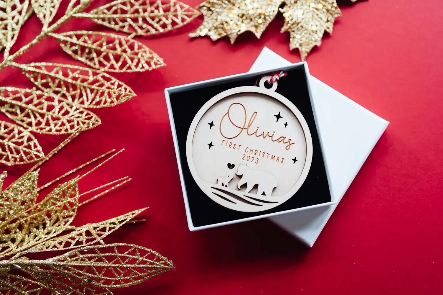 Close-up of the mama bear first christmas bauble engraved detail