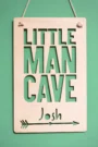Close-up detail of little man cave sign