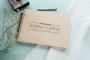 Close-up of the clean & modern wedding guest book engraved cover detail