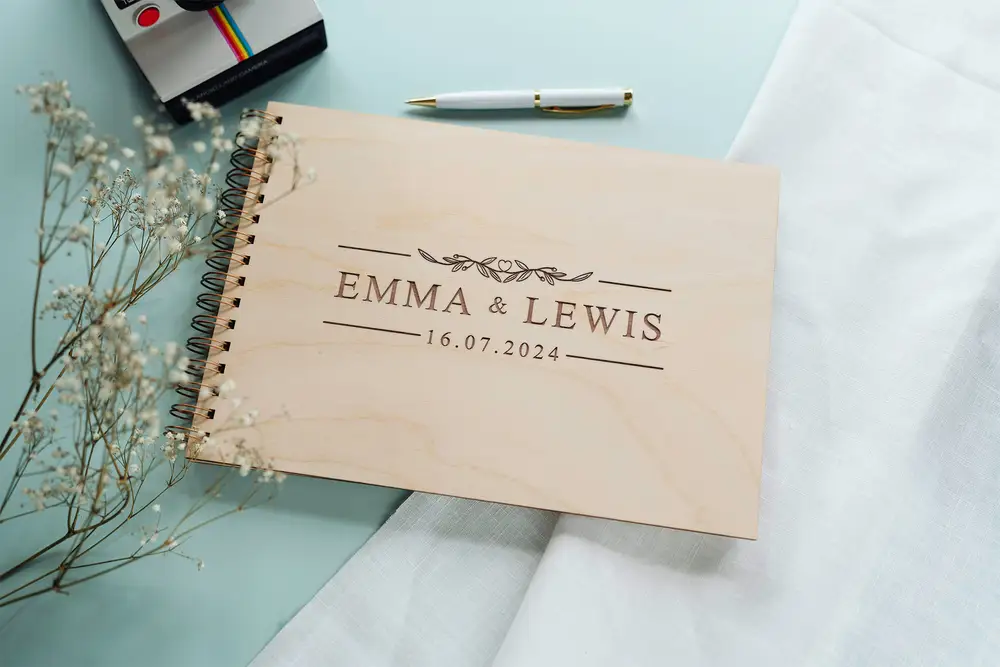 Close-up of the clean & modern wedding guest book engraved cover detail