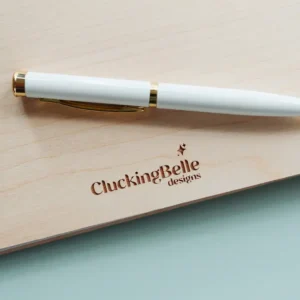 Open botanical wedding guest book showing thick 160gsm white pages with handwritten guest messages