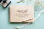 Floral Touch Wedding Guest Book 5 Close-up of the floral touch wedding guest book engraved cover detail