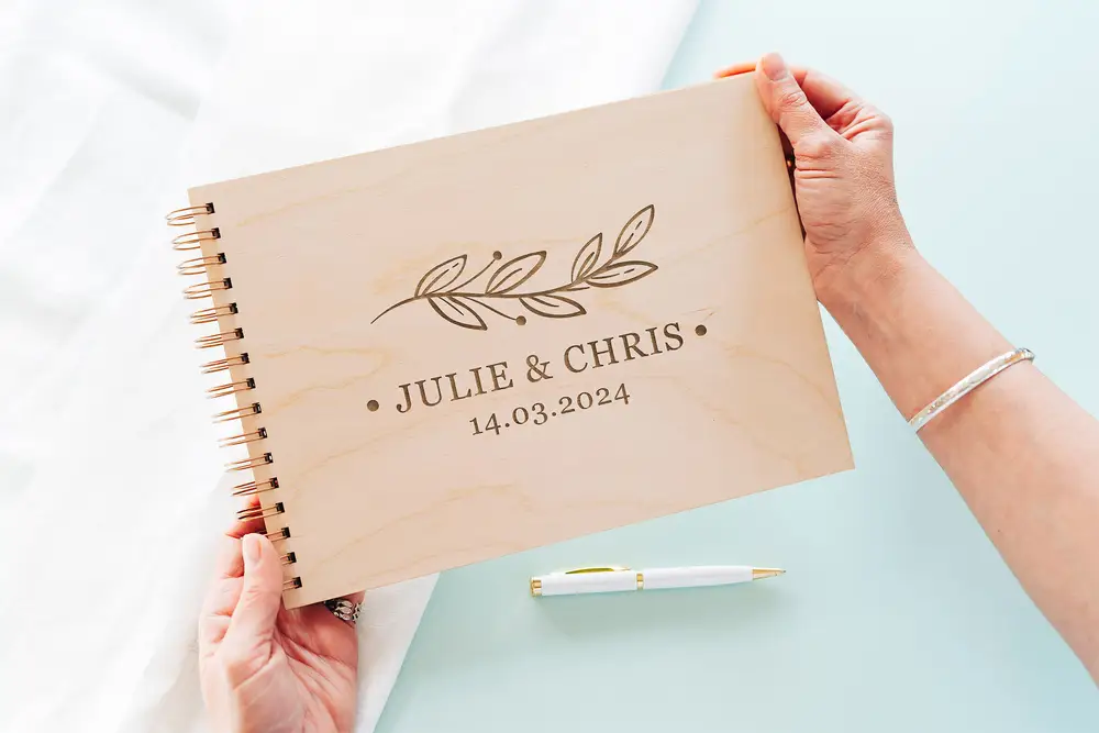31-05-2023-13-23-45.webp Laser-engraved wooden cover of the floral touch wedding guest book
