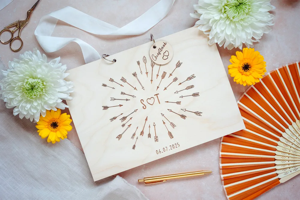 Laser-engraved wooden cover of the cupid's arrow wedding guest book
