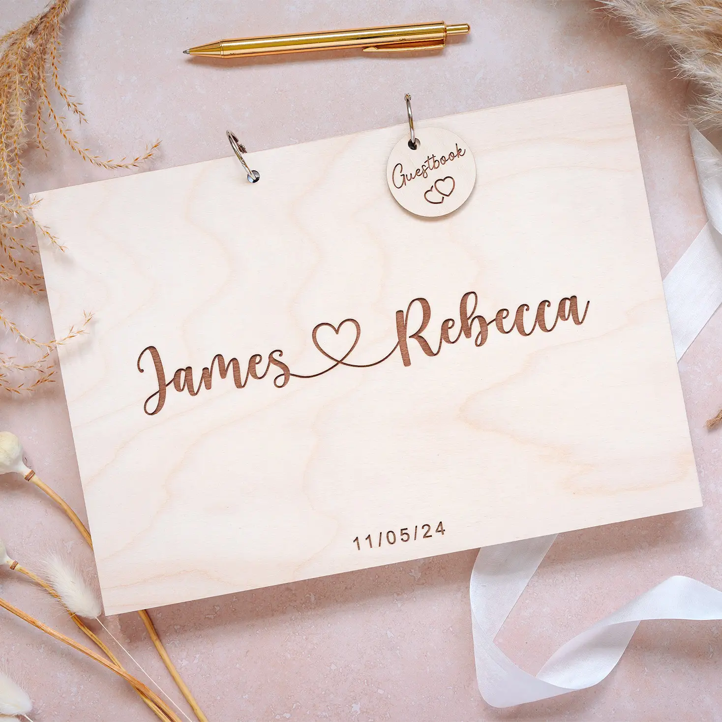 Personalised wooden wedding guest book with engraved couple name design on birch plywood cover