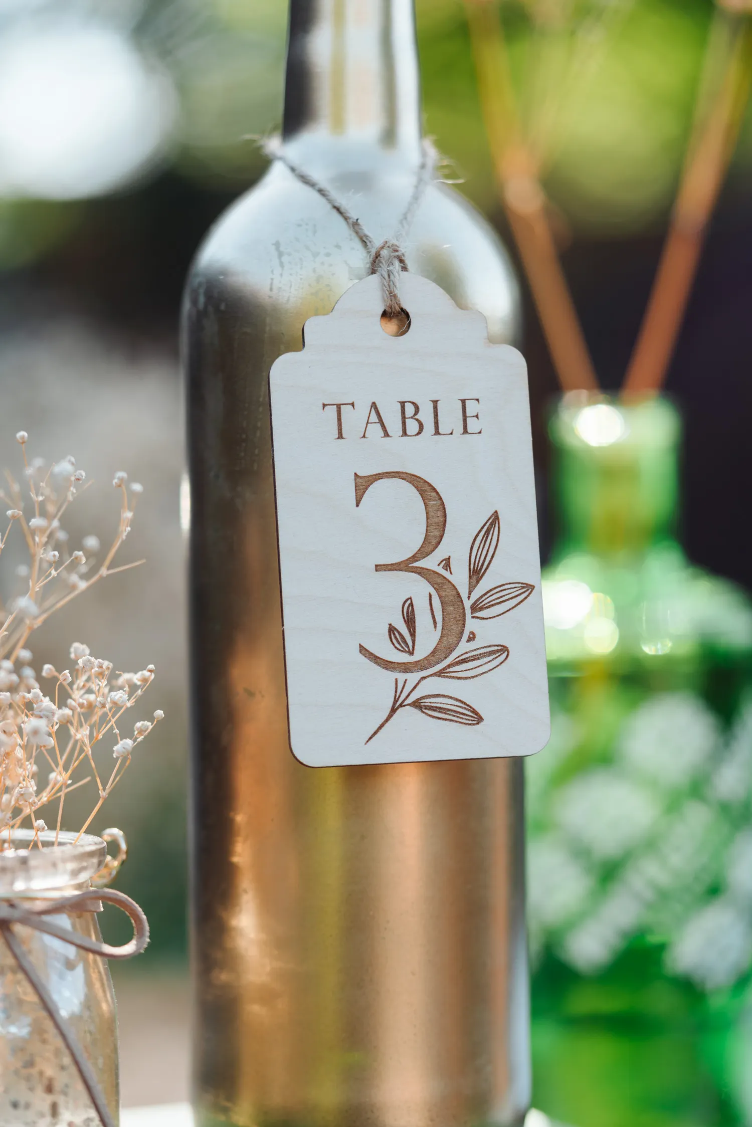 A0201972.webp Close-up detail of the flower design bottle table numbers engraving