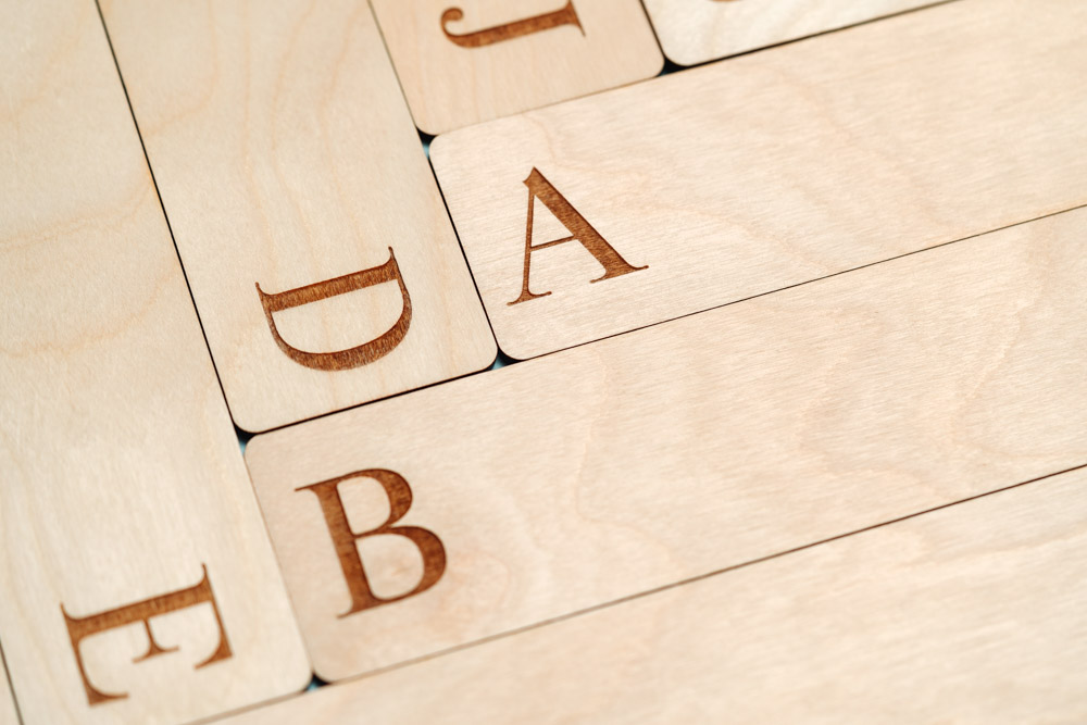 Close-up of an engraved 26-piece a-z engraved record divider