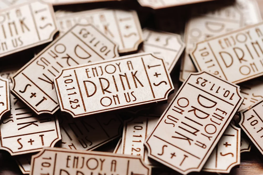 Set of art deco drink tokens for wedding guests