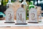 Wildflower Table Numbers 8 Wildflower Table Numbers styled with floral wedding decorations
