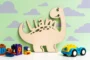 Dinosaur name sign displayed in a child's bedroom