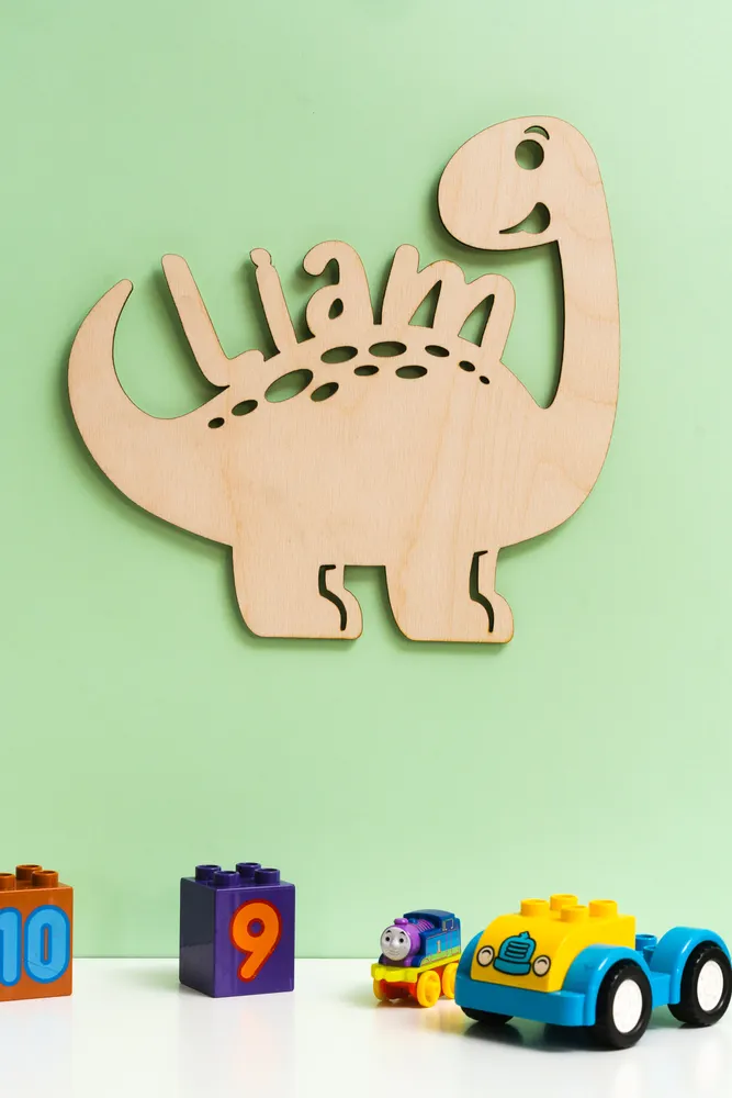Dinosaur themed wooden name sign for nursery décor