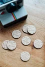 Boho Love Heart Drink Tokens held in hand showing engraved detail