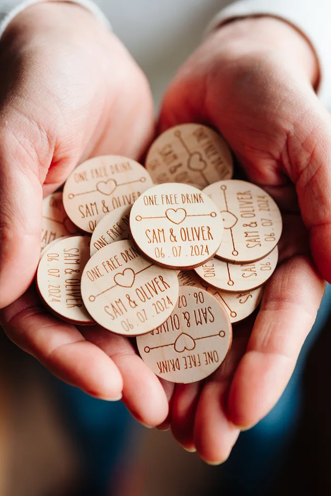 Close-up detail of boho love heart drink tokens