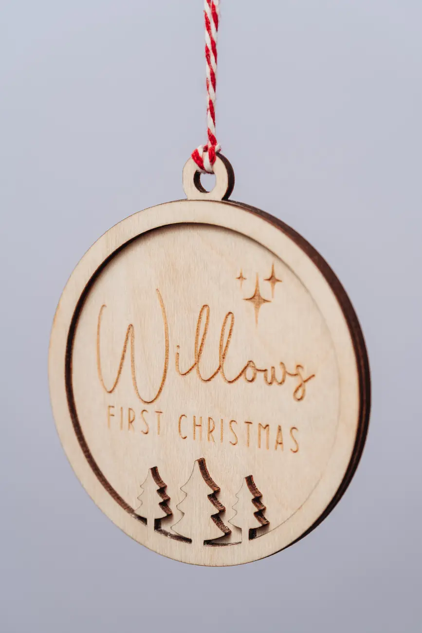 Close-up of the child's first christmas bauble engraved detail