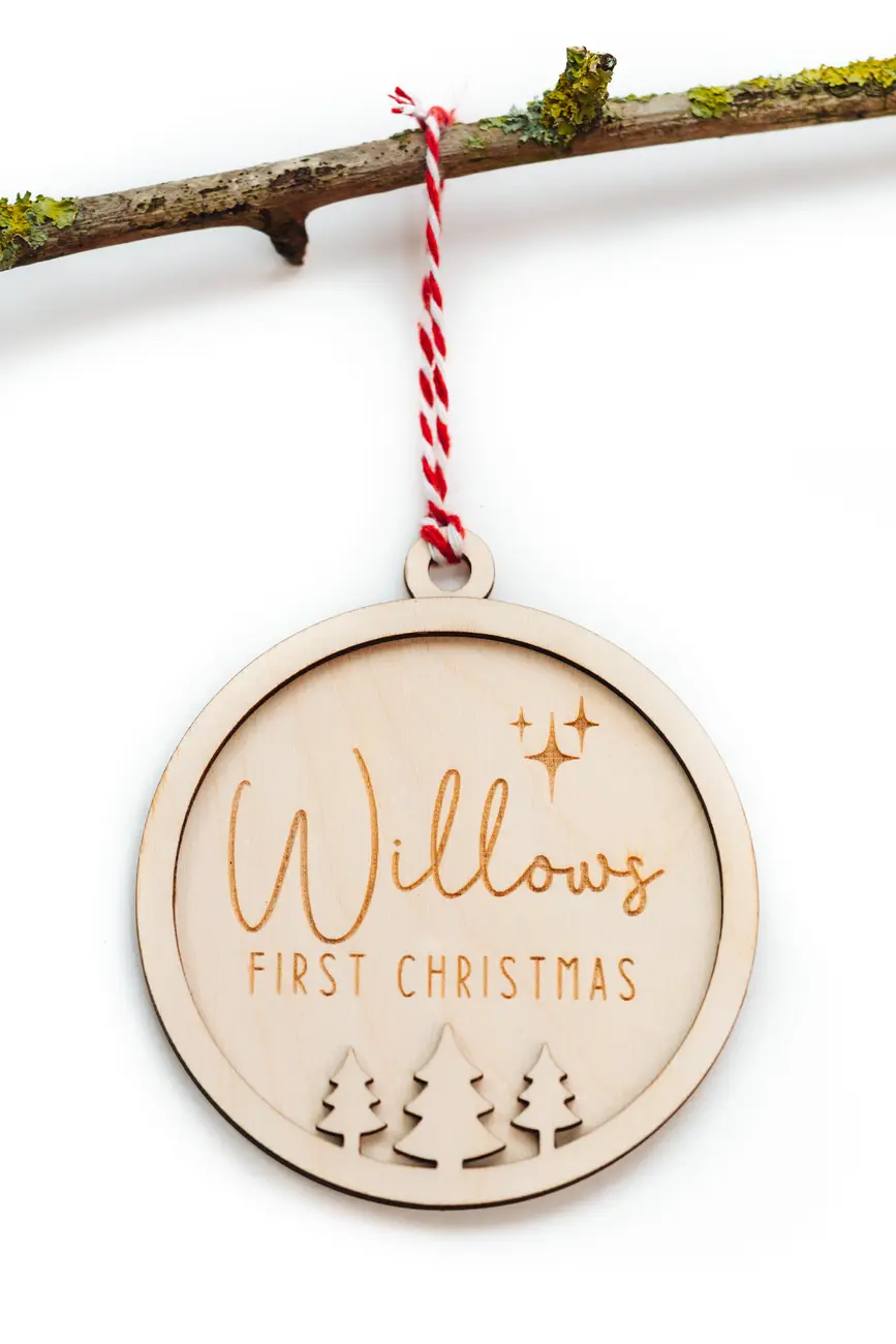 Child's First Christmas Bauble hanging on a Christmas tree