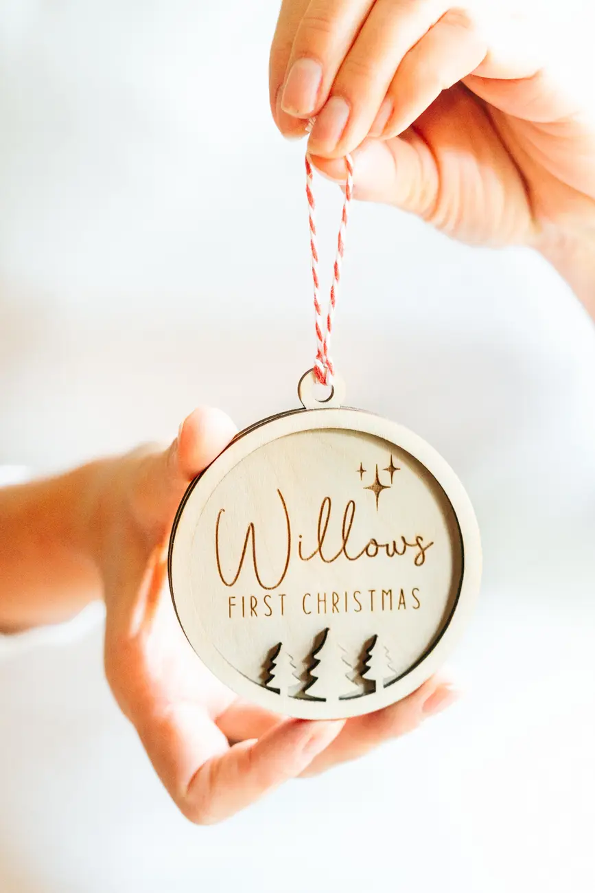 Child's First Christmas Bauble shown with festive decorations