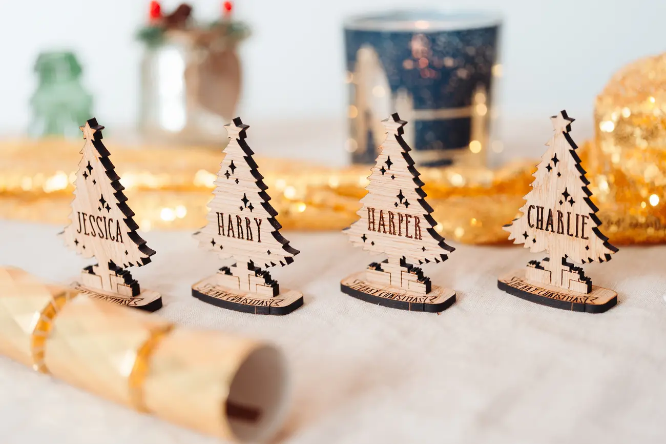 Christmas Tree Place Settings arranged on a festive dinner table