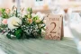 Close-up detail of the wildflower oak table numbers engraving