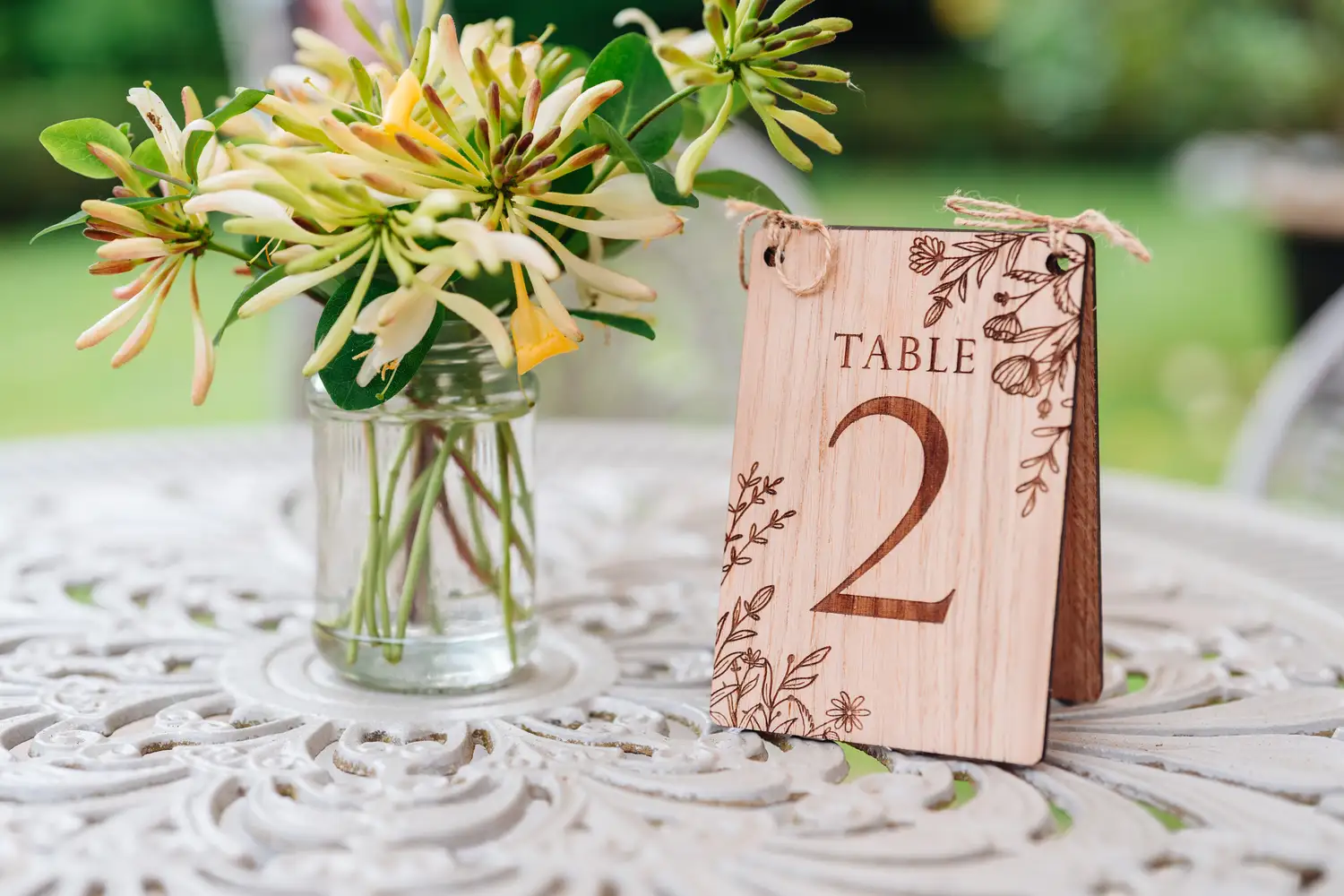 Laser-engraved oak freestanding oak table numbers with natural wood grain