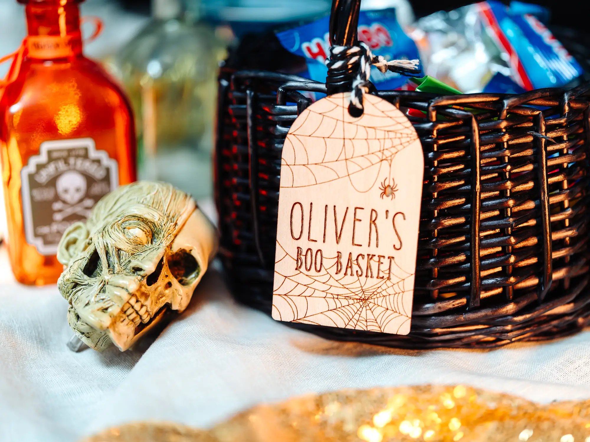 Close-up of the spider's web boo basket tag engraving