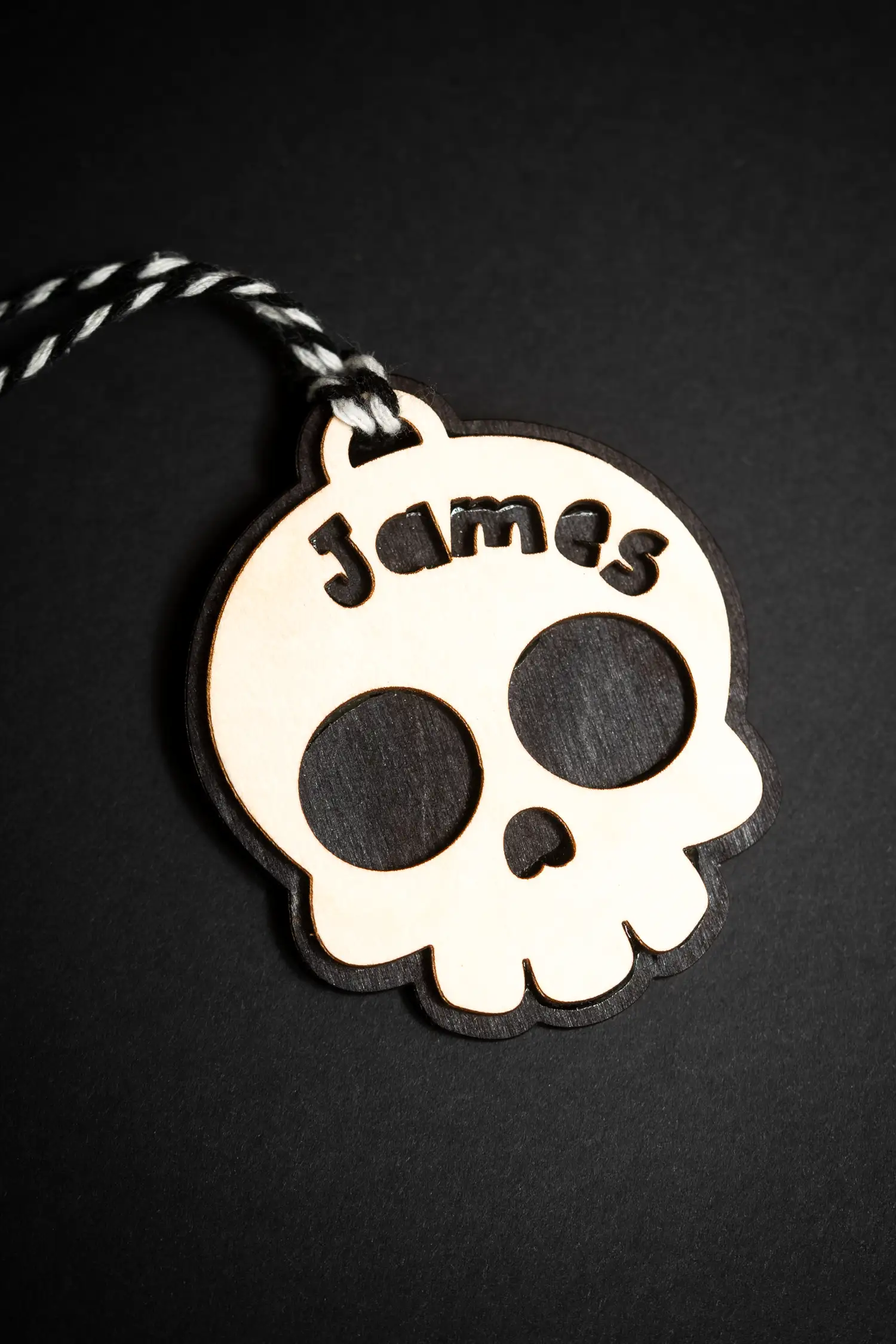 Close-up of the skull boo basket tag engraving