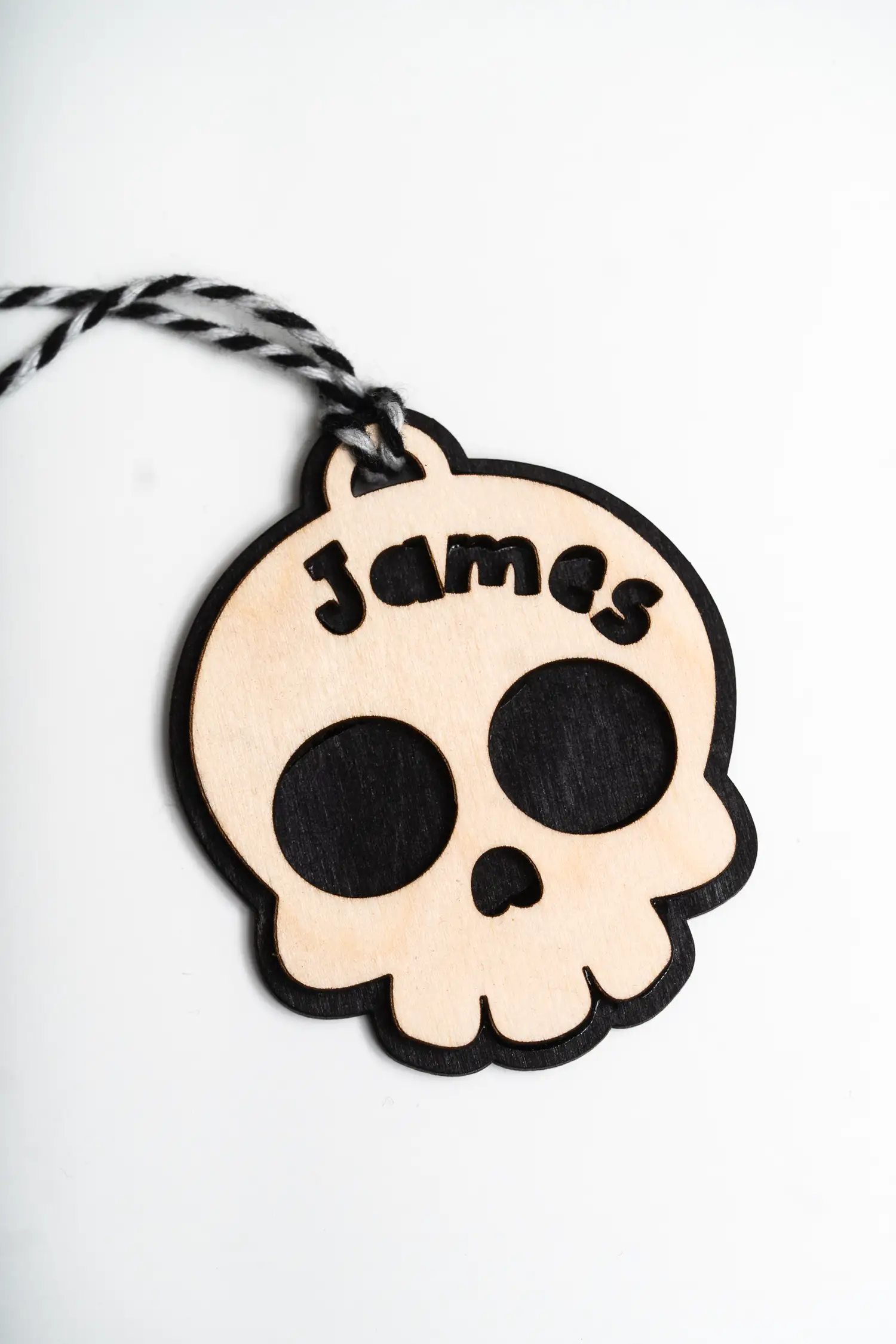 Skull Boo Basket Tag tied to a Halloween treat basket