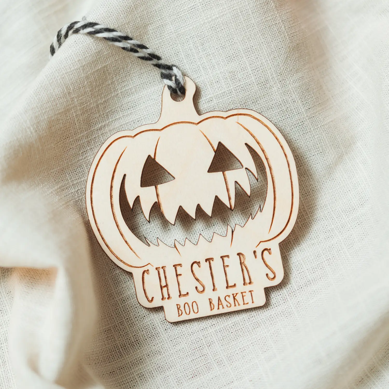 Close-up of the pumpkin boo basket tag engraving