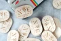 Personalised wooden one free drink wedding tokens with engraved design used as wedding bar vouchers