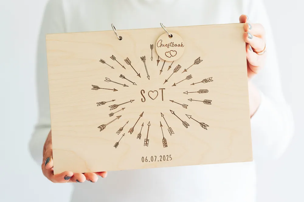 Cupid's Arrow Wedding Guest Book open showing the lined interior pages
