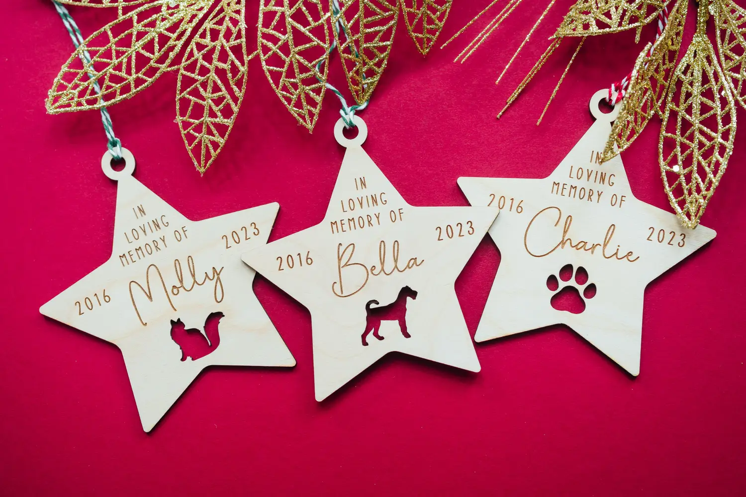 A0307851.webp close-up of pet memorial engraved wooden Christmas bauble showing personalised detail